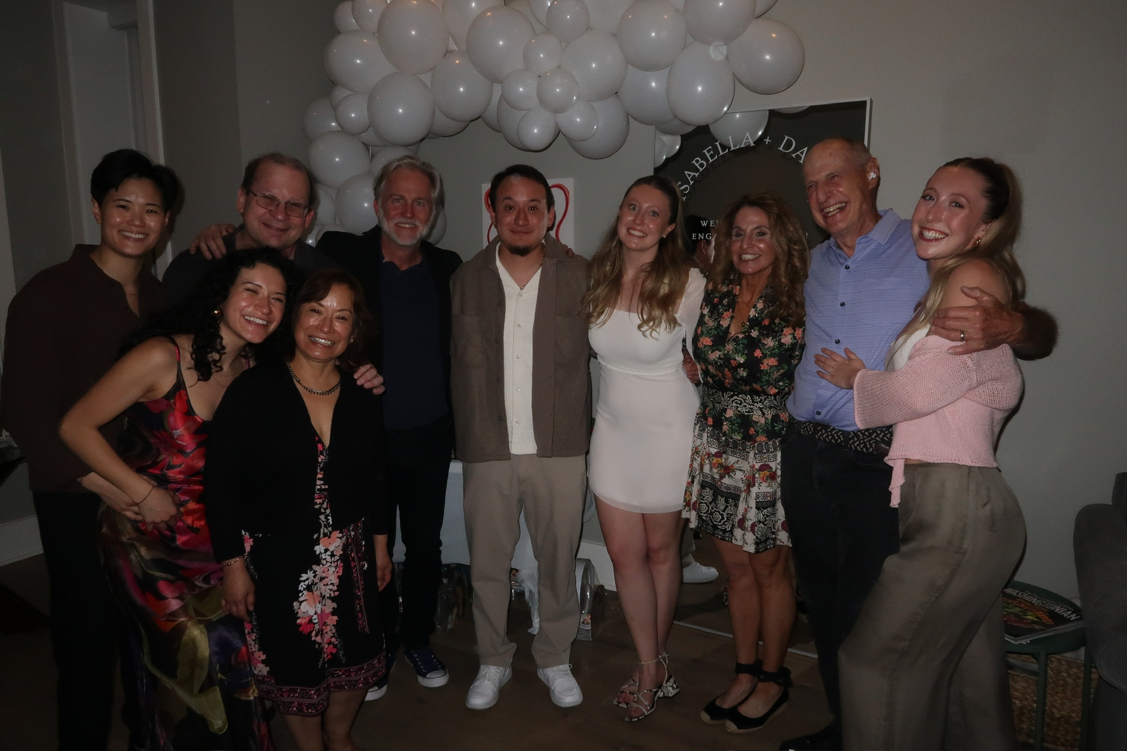 Isabella and David with their families at the engagement party